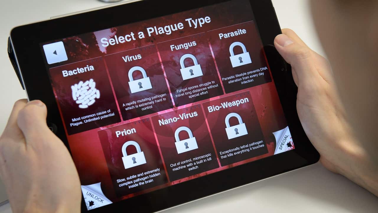 Man playing Plague Inc. on a tablet.