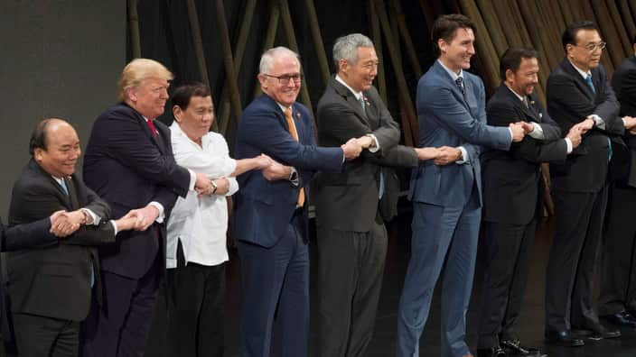 World leader take part in a handshake with other leaders at the opening ceremony for the ASEAN conference in Manila.