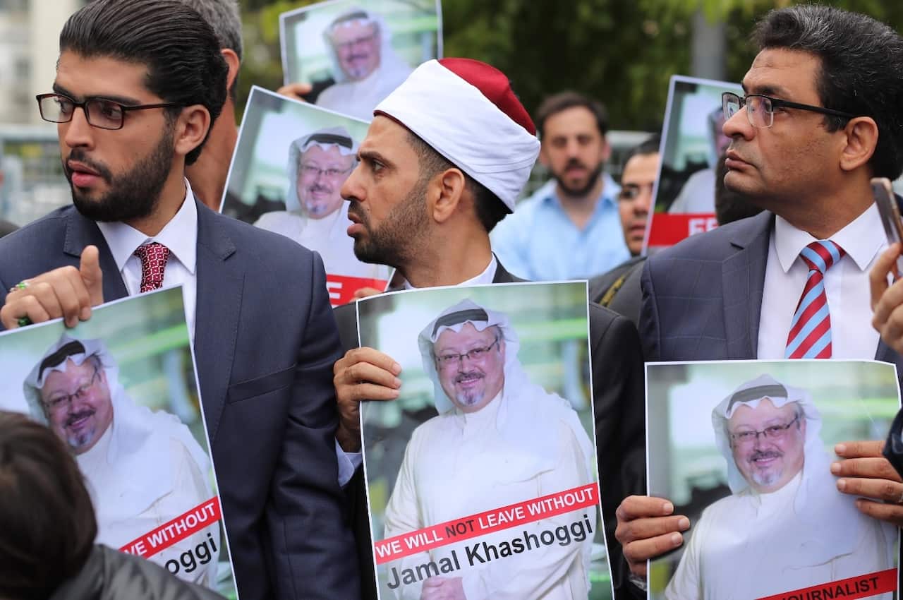 Protesters hold pictures of missing Saudi journalist Jamal Khashoggi during a demonstration organized by Turkish-Arabic Media Association 