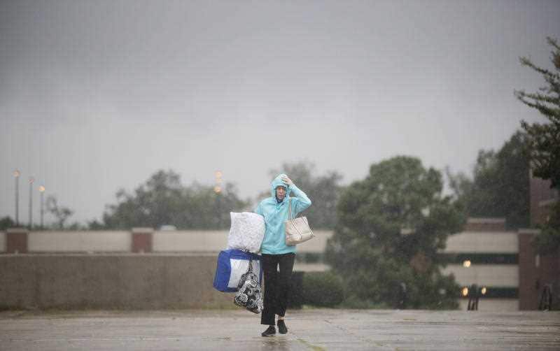 A woman makes her way to an evacuation shelter in Tallahassee, Florida. Hurricane Michael has forced thousands of residents to flee their homes.