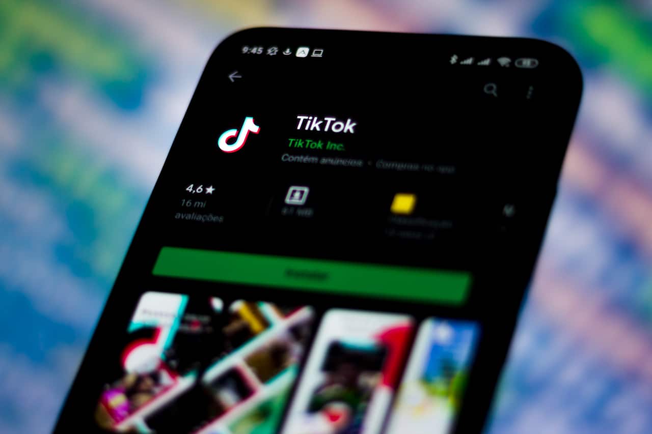 In this photo illustration a TikTok logo seen displayed on a smartphone. 