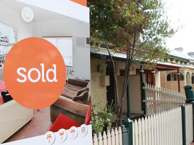 A house with a sold sign in Melbourne.