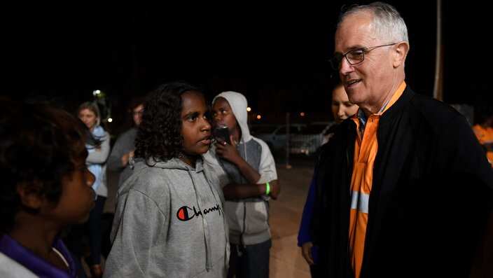 Prime Minister Malcolm Turnbull meets local kids as he rides along in a Julalikari Youth Night Patrol convoy, at Tennant Creek, in the Northern Territory.