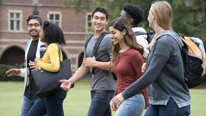 Diverse Group of University Students Walking on Campus