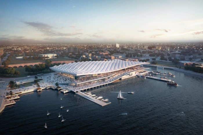 The new building will sit over the water and feature a roof inspired by fish scales