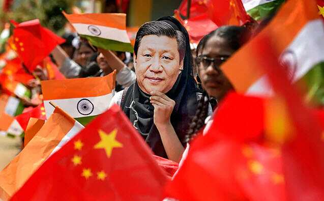The students at the Chennai school also waved the national flags of India and China.