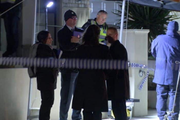 Police fire a number of shots in a bid to distract the dog.