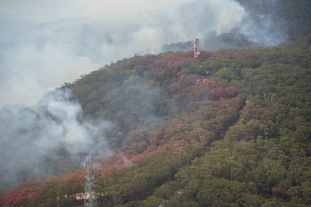 An aerial view of lines of fire retardant during a flight over Kurrajong Heights.