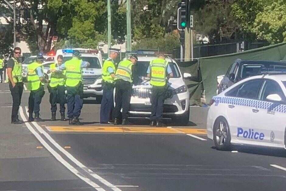 Boy killed after after being hit and pinned under a car outside Sydney school