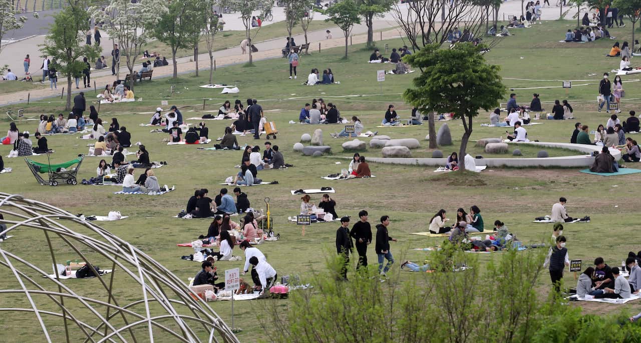 Citizens enjoy picnics at Yeouido Hangang Park in Seoul, South Korea.
