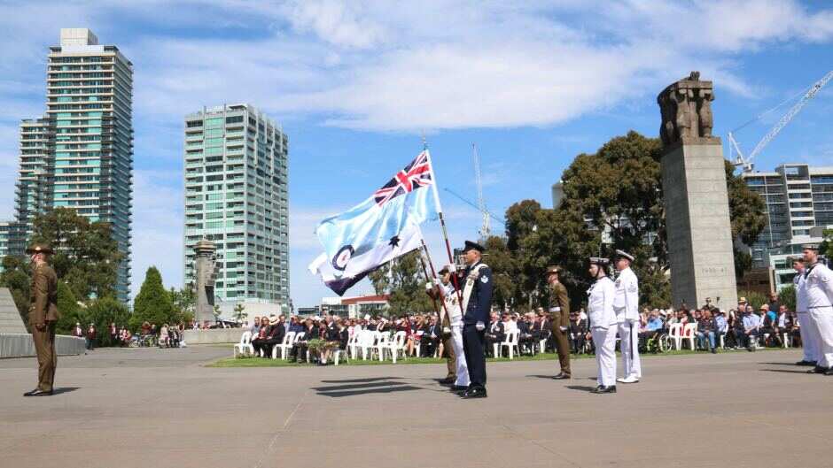 Flags for the three military services fly at Melbourne's Shrine of Remembrance