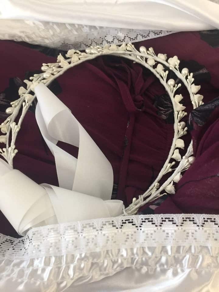 Courtney in her casket with a wreath