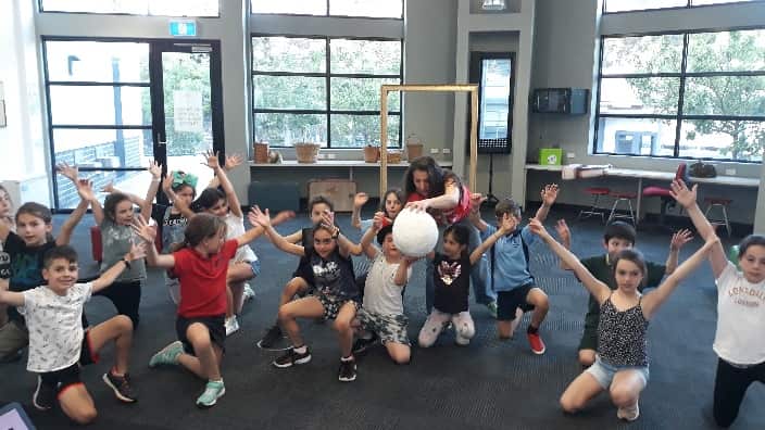 At the play rehearsals. 