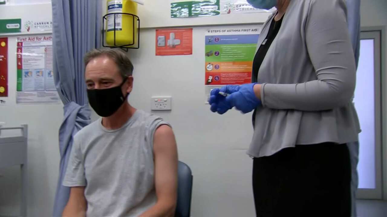 Health Minister Greg Hunt preparing to receive his first dose of the AstraZeneca coronavirus vaccine.