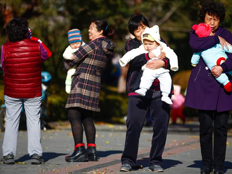 Parents and babies in a park in Beijing