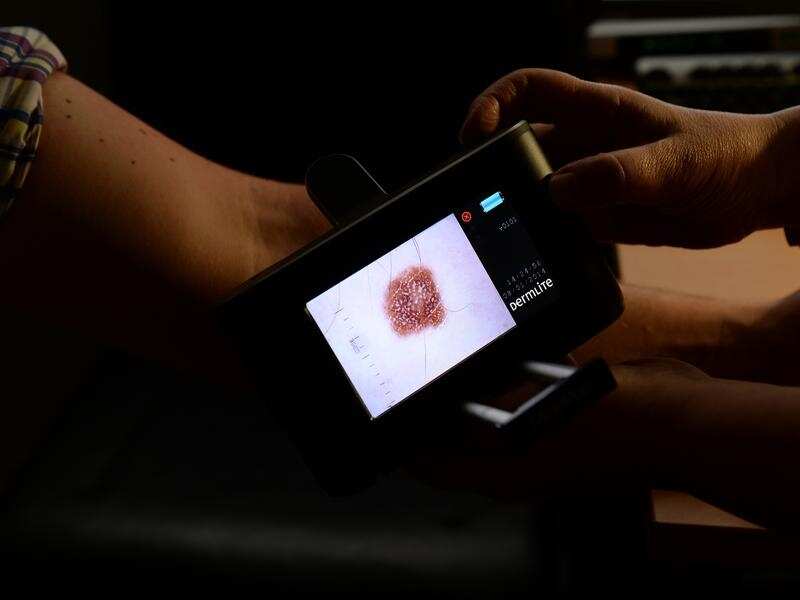 A patient is checked for skin cancers at a skin cancer clinic