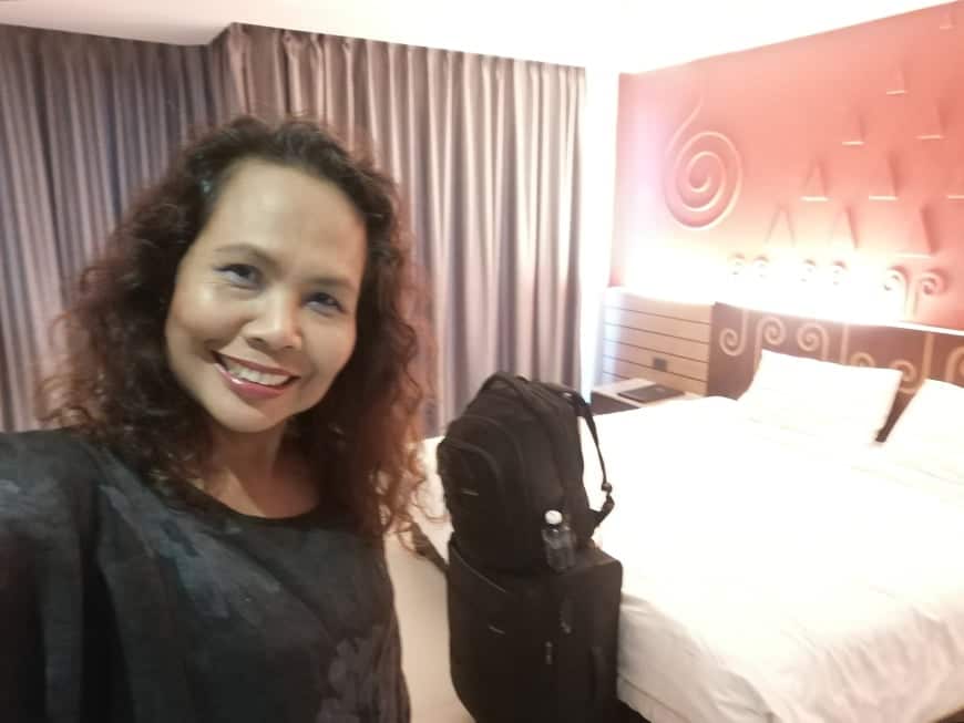 Sompit and her room in a state quarantine hotel 