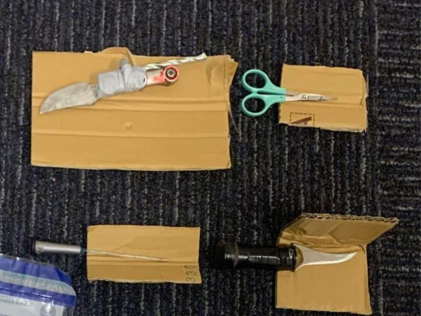 Weapons found in the man's car allegedly included a homemade knife.