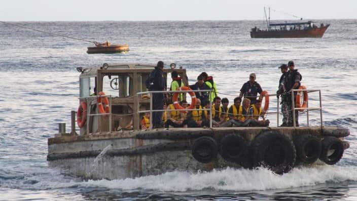 A boat carrying asylum seekers arriving at Christmas Island in 2012