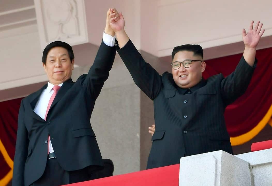 North Korean leader Kim Jong-un, right,  and Li Zhanshu, the third-highest ranking official in the ruling Communist Party of China.