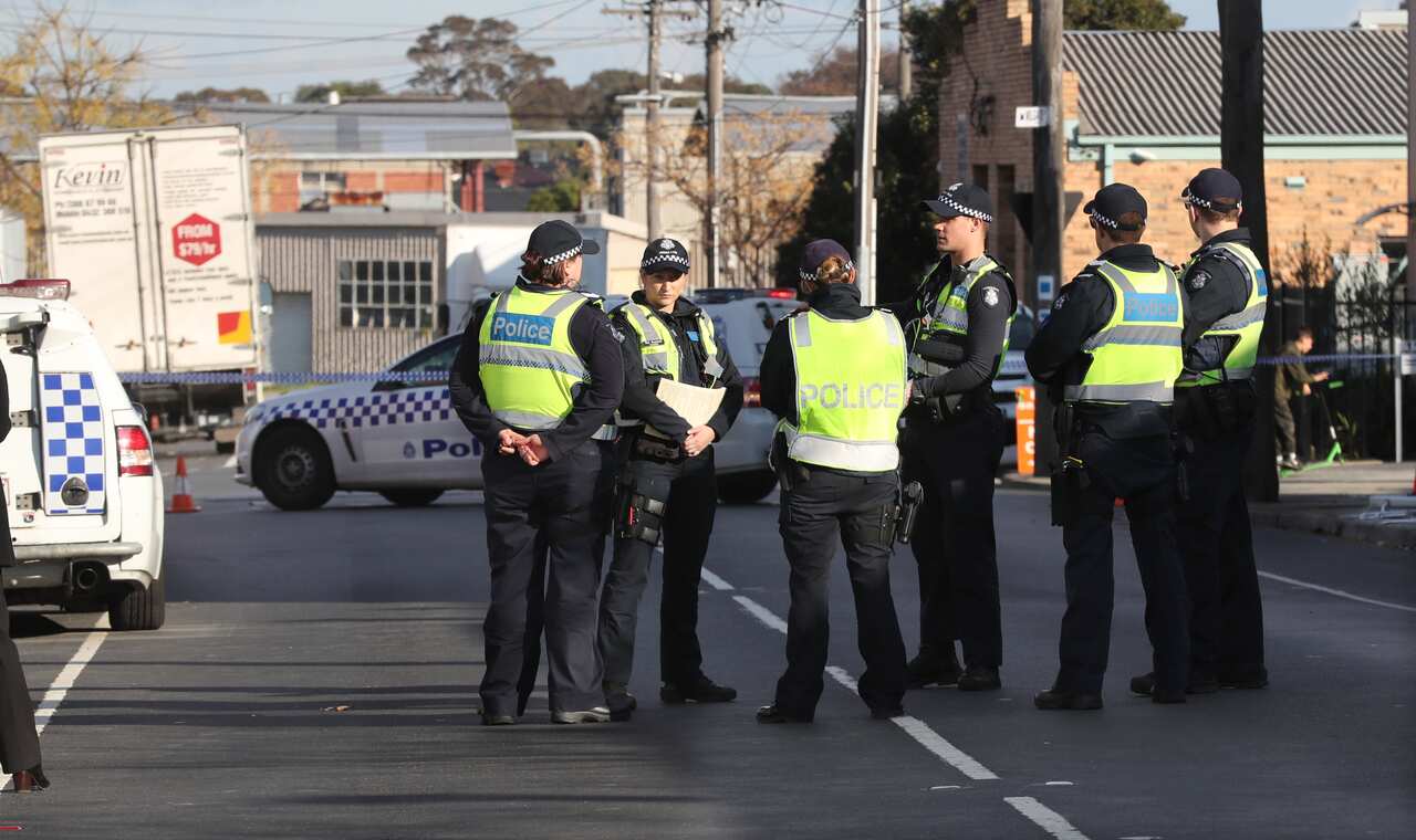 Police are seen working at the scene where human remains have been found wrapped in plastic at a storage facility in Oakleigh South, Melbourne, Friday, July 13. 2018. (AAP Image/David Crosling) NO ARCHIVING