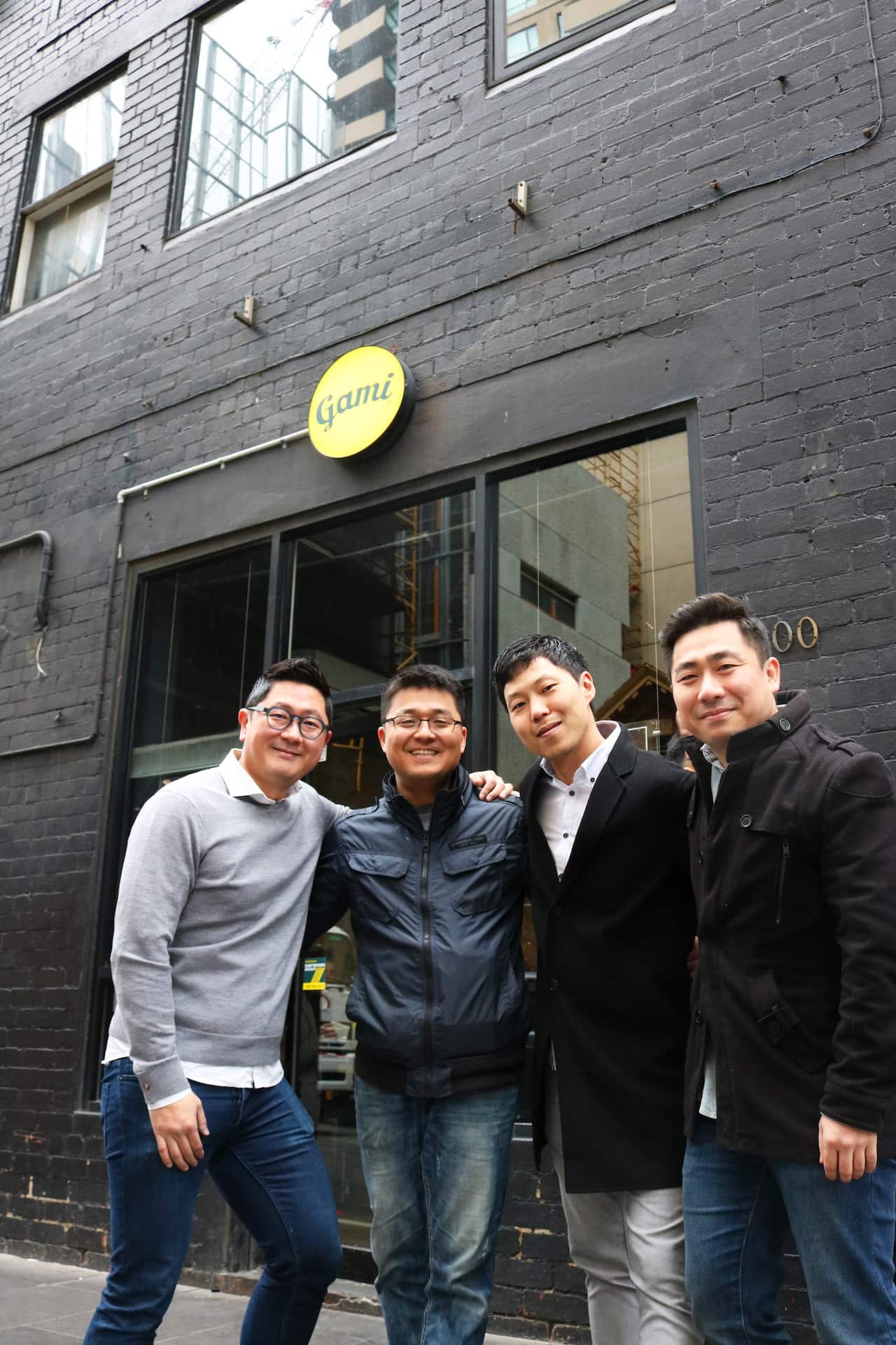 The friends outside one of their Gami outlets.