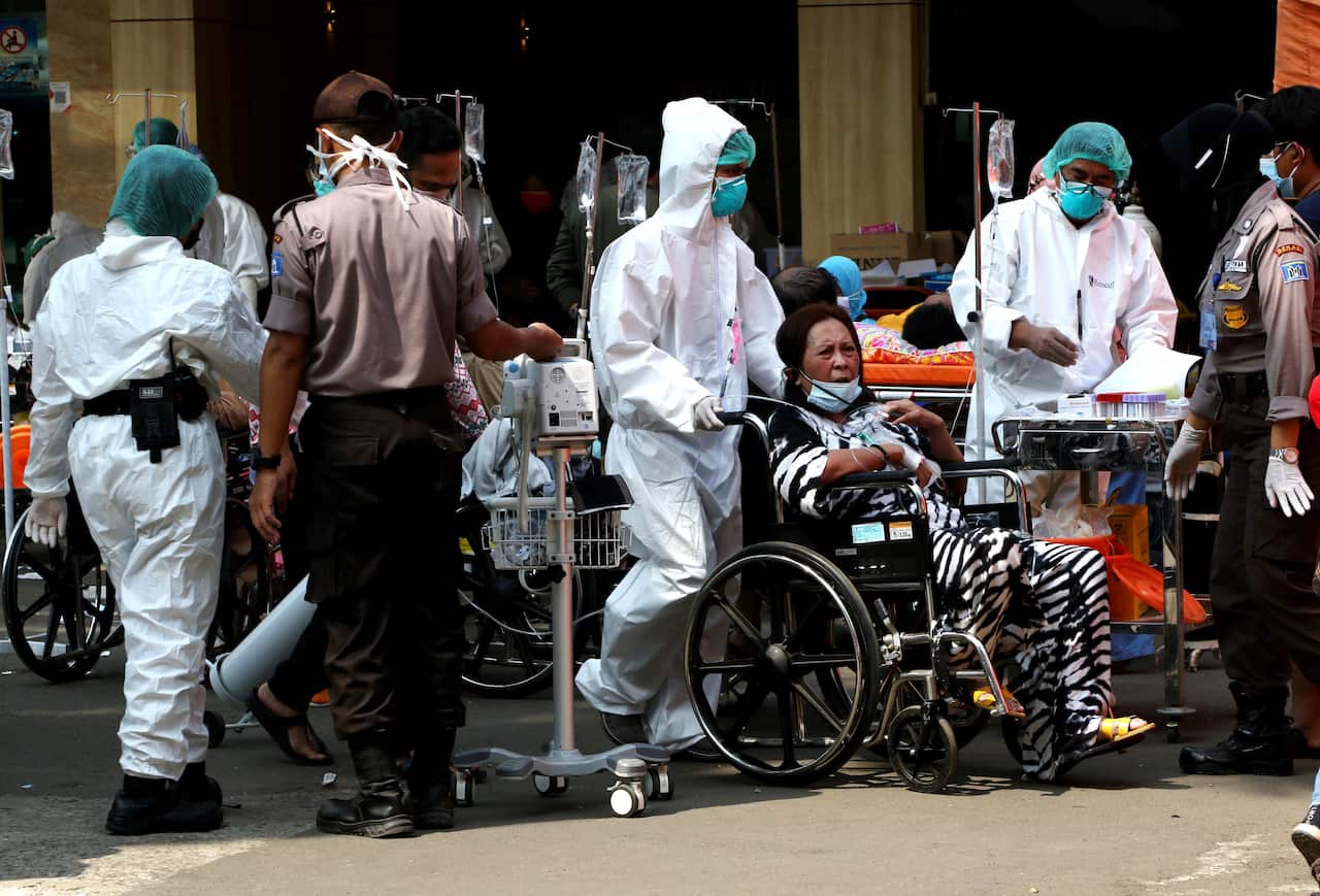 Indonesia has warned it is bracing for a punishing surge in COVID-19 cases as its daily toll soared to a record 728 deaths.