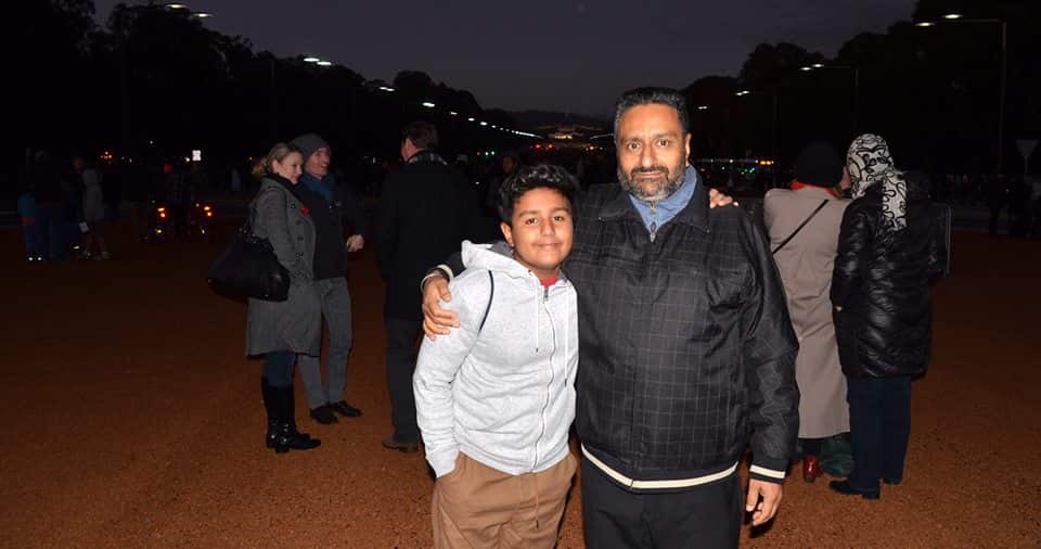 Sukhwinder Saggu with his son at the Dawn Service