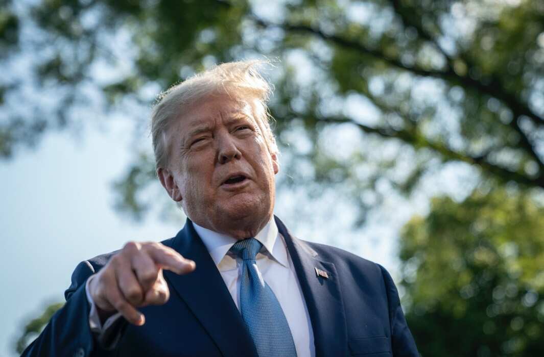 Donald Trump talks to reporters.