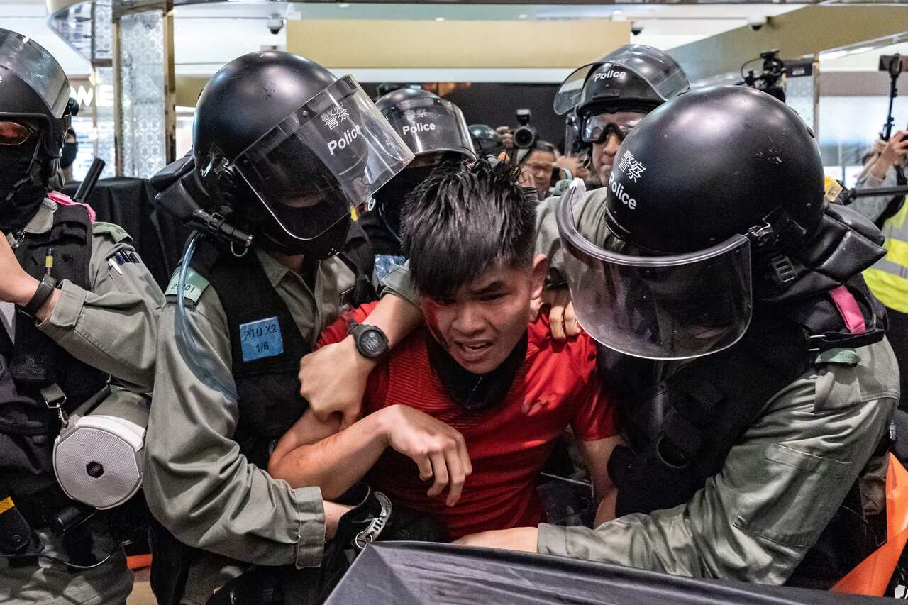 A man was detained by riot police during a demonstration in a shopping mall at Sheung Shui district.