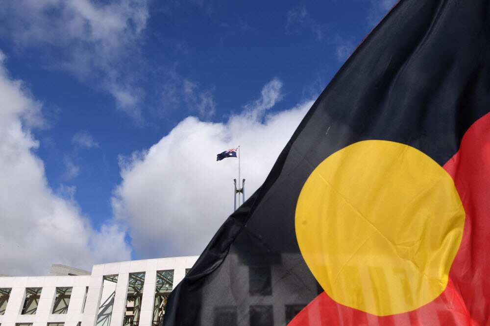 Parliament House seen through an Aboriginal flag in Canberra, Tuesday, September 5, 2017