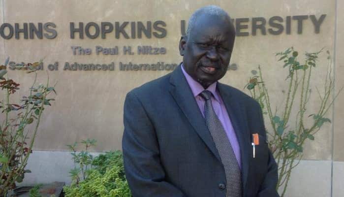 Justice Bullen Panchol Awal Alier post for a photo in USA