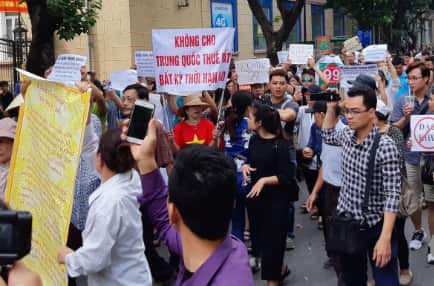 Protesters hold a banner reading, “No leasing land to China even for any time” during a demonstration in Hanoi on Sunday.