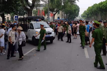 Police break up a demonstration in Hanoi on Sunday.