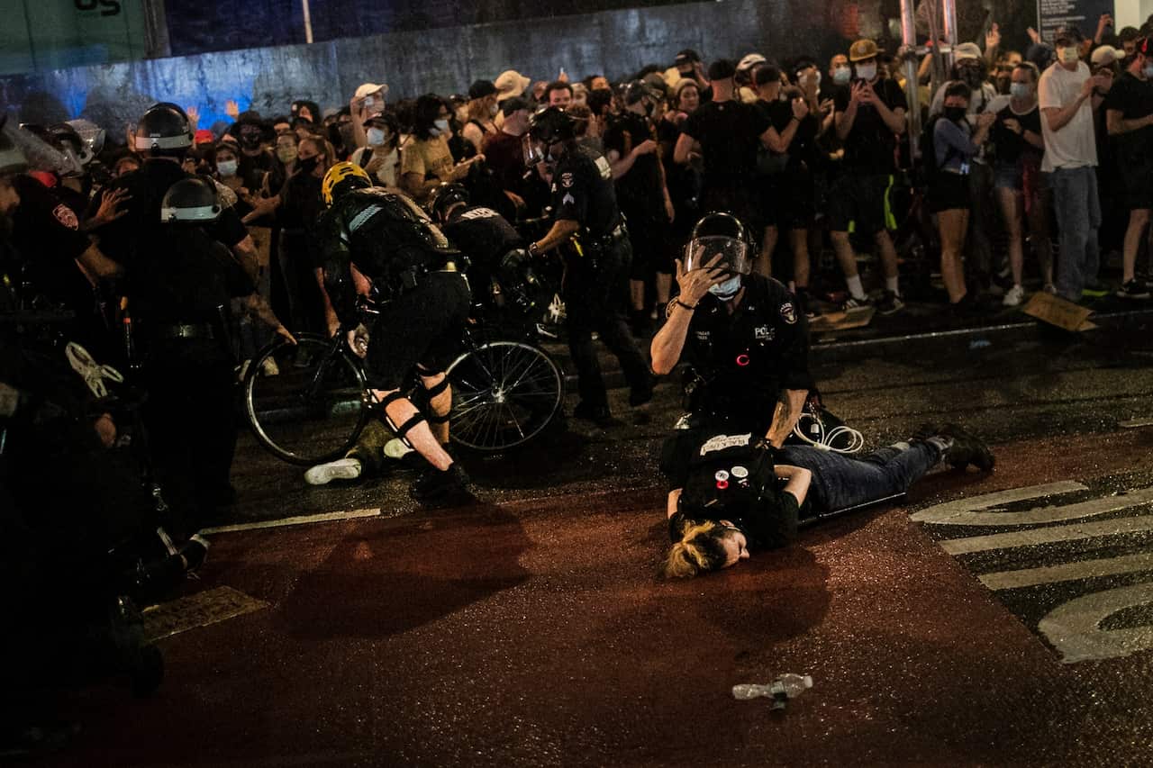 Police arrest protesters who broke curfew by marching through Manhattan, New York during a solidarity rally Wednesday, June 3, 2020