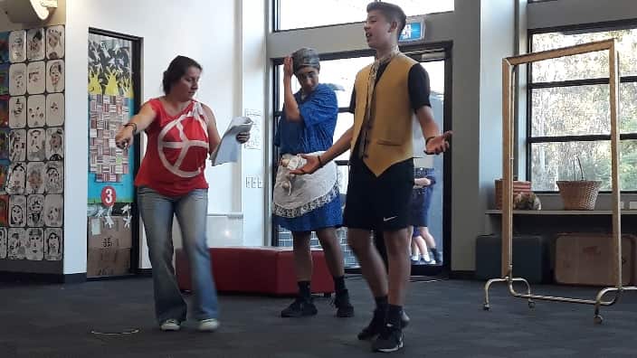 At the play rehearsals. 