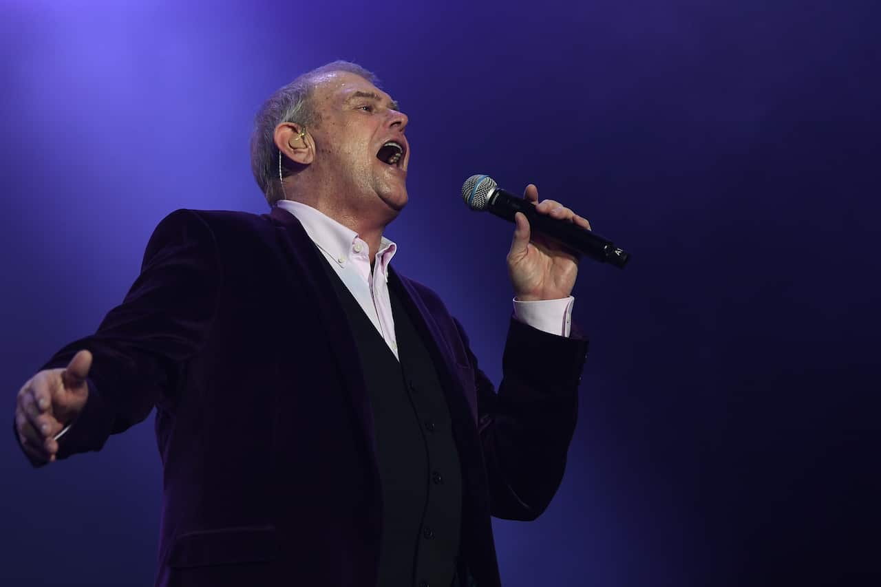 John Farnham performs during the Fire Fight Australia bushfire relief concert at ANZ Stadium in Sydney, Sunday, February 16, 2020. (AAP Image/Joel Carrett) NO ARCHIVING