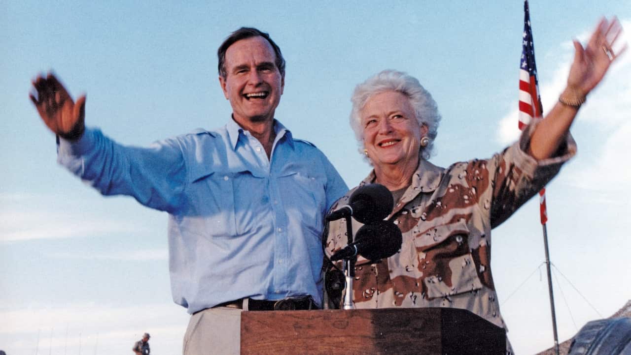 United States President George H.W. Bush and first lady Barbara Bush visit US military personnel on Thanksgiving in Saudi Arabia in 1990.