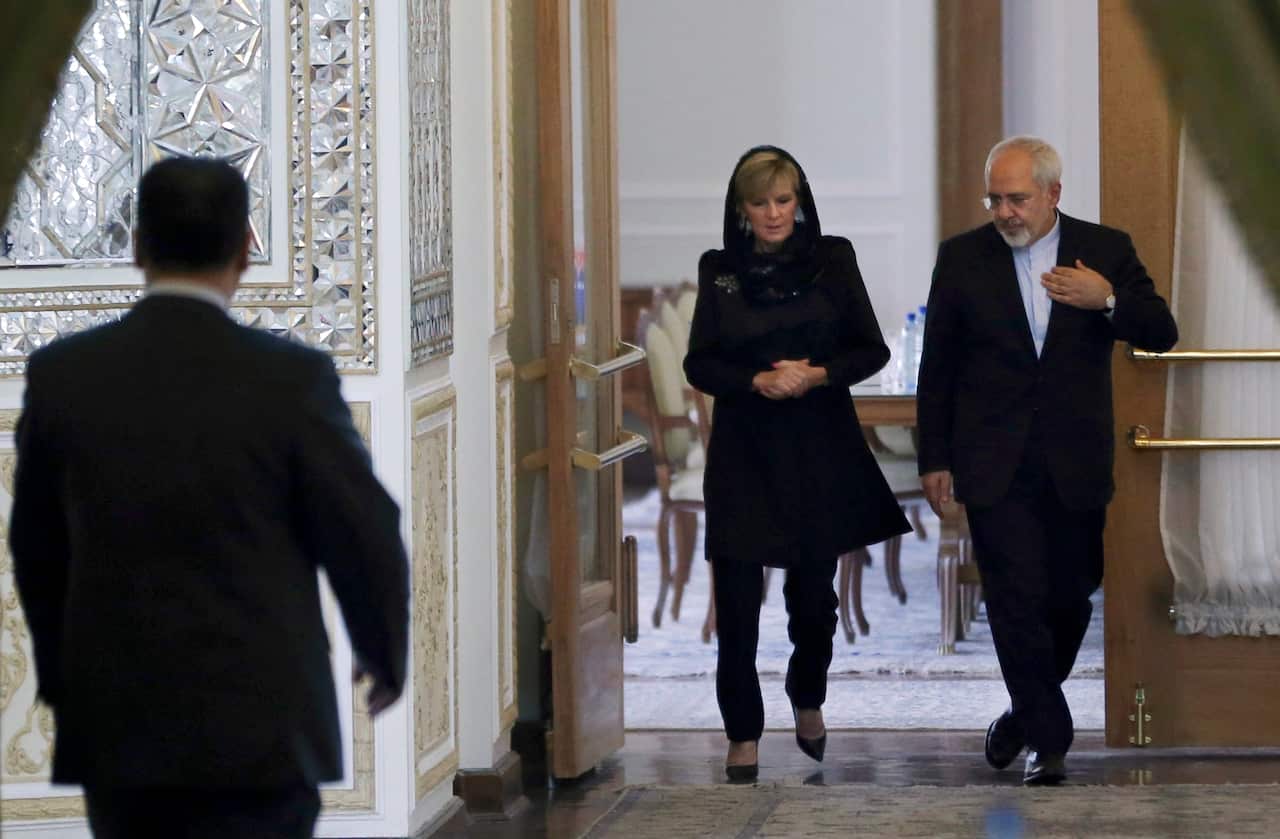 Australian Foreign Minister Julie Bishop, center, arrives with her Iranian counterpart Mohammad Javad Zarif for a joint press conference, in Tehran, Iran.