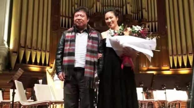 Teddy with Junus with his daughter, a violinist, in the symphony at Sydney Opera House