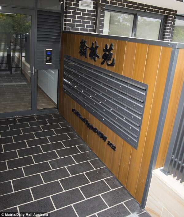 While the sign at the front of the building had been covered up, Mandarin symbols at the doors to the complex can still be seen