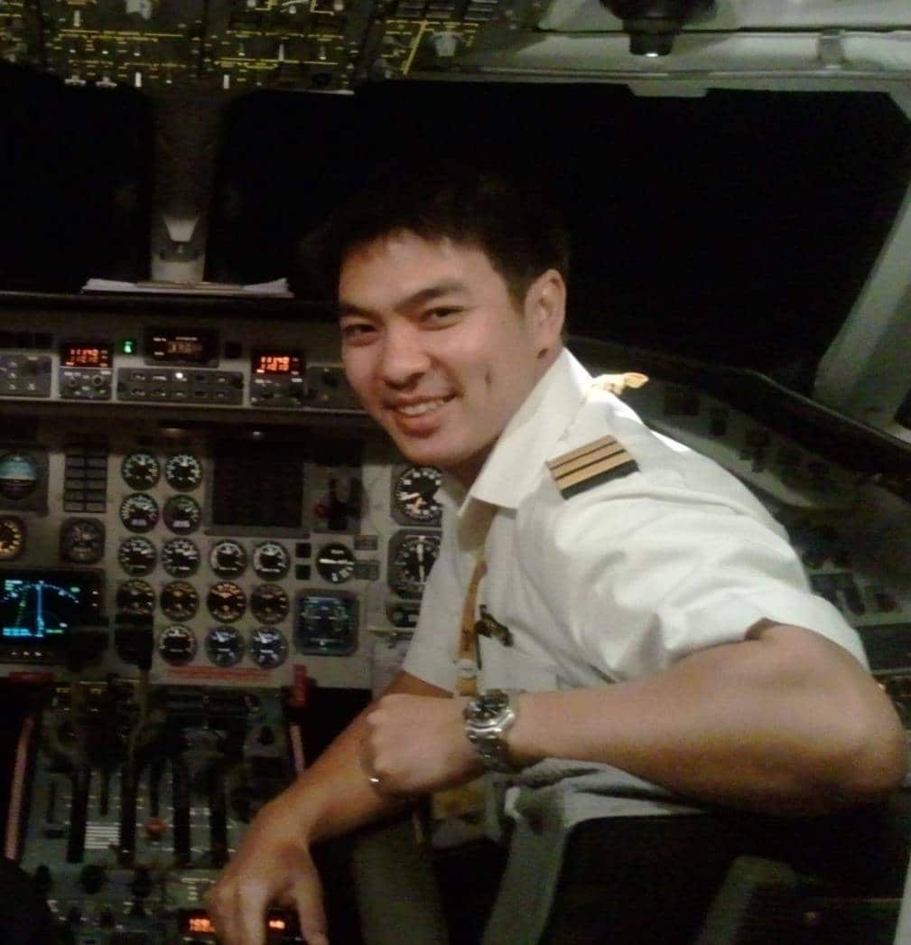 Image of Karn Sri-ampai on a pilot seat inside a cockpit