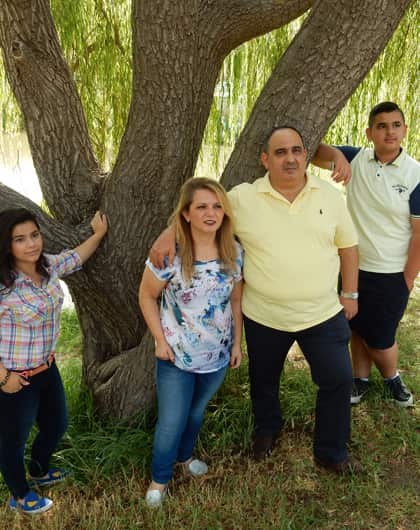 Osama Butti, pictured with his family, has struggled for more than three years to find a permanent job.