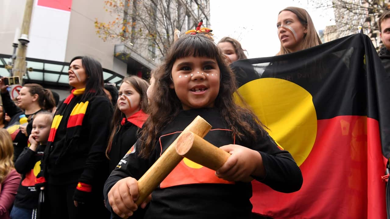 People participate in a NAIDOC Week march in Melbourne, 5 July 2019.  
