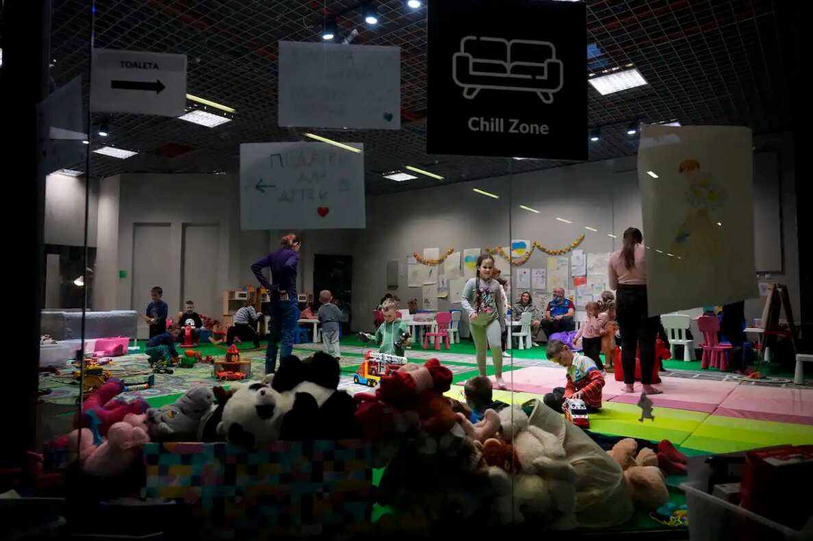Children from Ukraine play at an exhibition hall, turned into a refugee center in Nadarzyn, near Warsaw, Poland, on 23 March 2022.