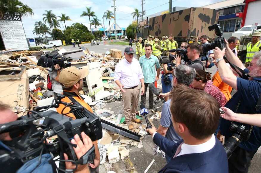 Prime Minister Scott Morrison (center) visits a flood-affected street in Milton, with ADF personnel on 10 March, 2022, in Brisbane.