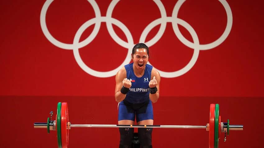 Philippines' Hidilyn Diaz reacts while competing in the women's 55kg weightlifting competition during the Tokyo 2020 Olympic Games