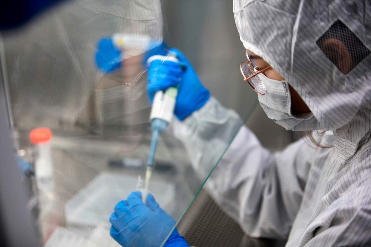 A technician examines the test kits for the coronavirus in China's Yangzhou city.