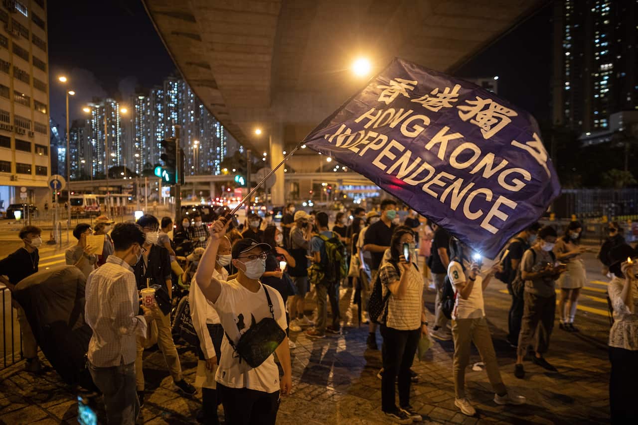 Pro-democracy activist take part in a rally on the eve of the Beijing Tiananmen Massacre anniversary in Hong Kong.