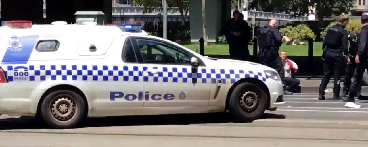 Victoria Police question the alleged driver on the side of the road.